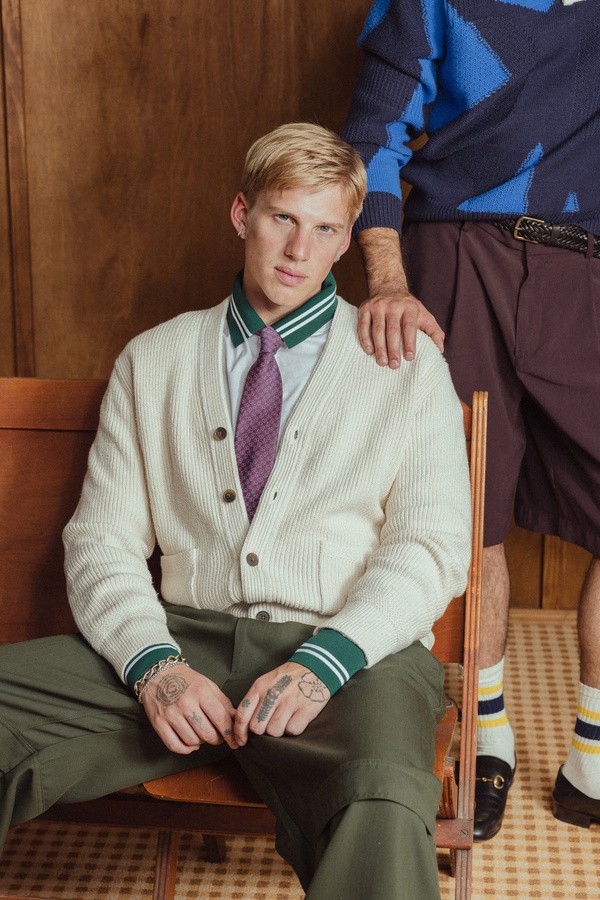 sitting on a chair posing for a picture