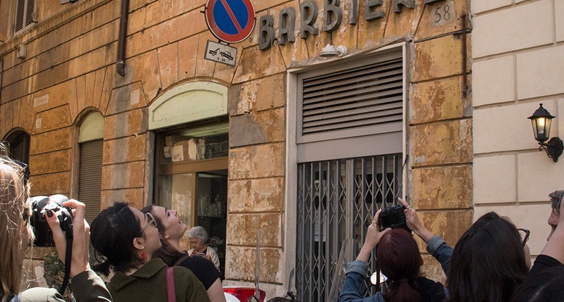 people at street holding cameras