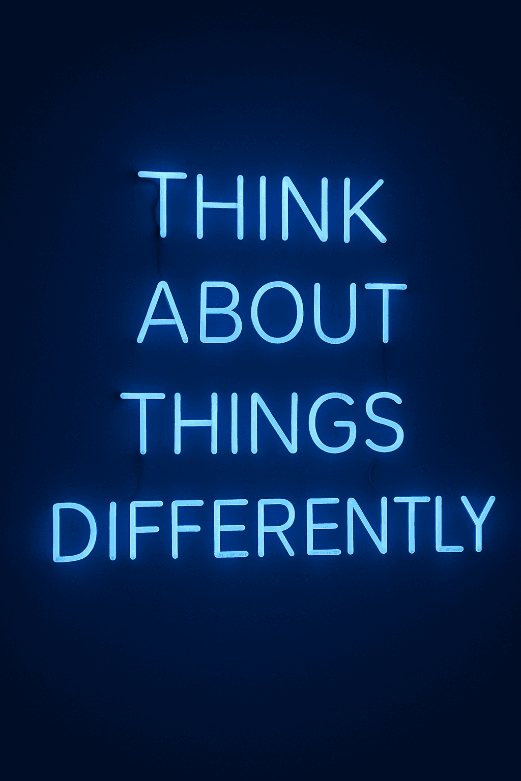 Blue neon sign with 'Think About Things Differently' reflecting WeLead’s creative and innovative marketing philosophy.