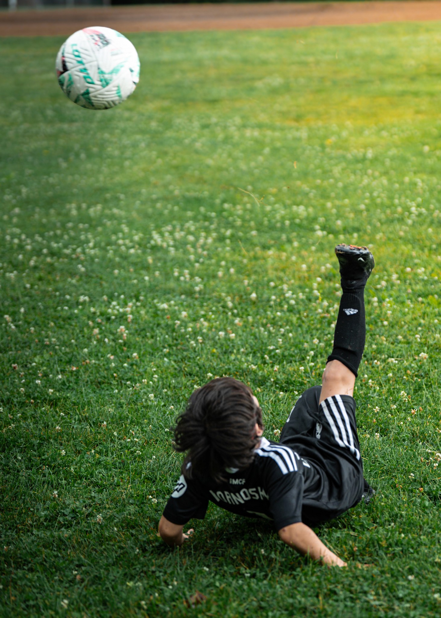 soccer boy in action kicking soccer bal