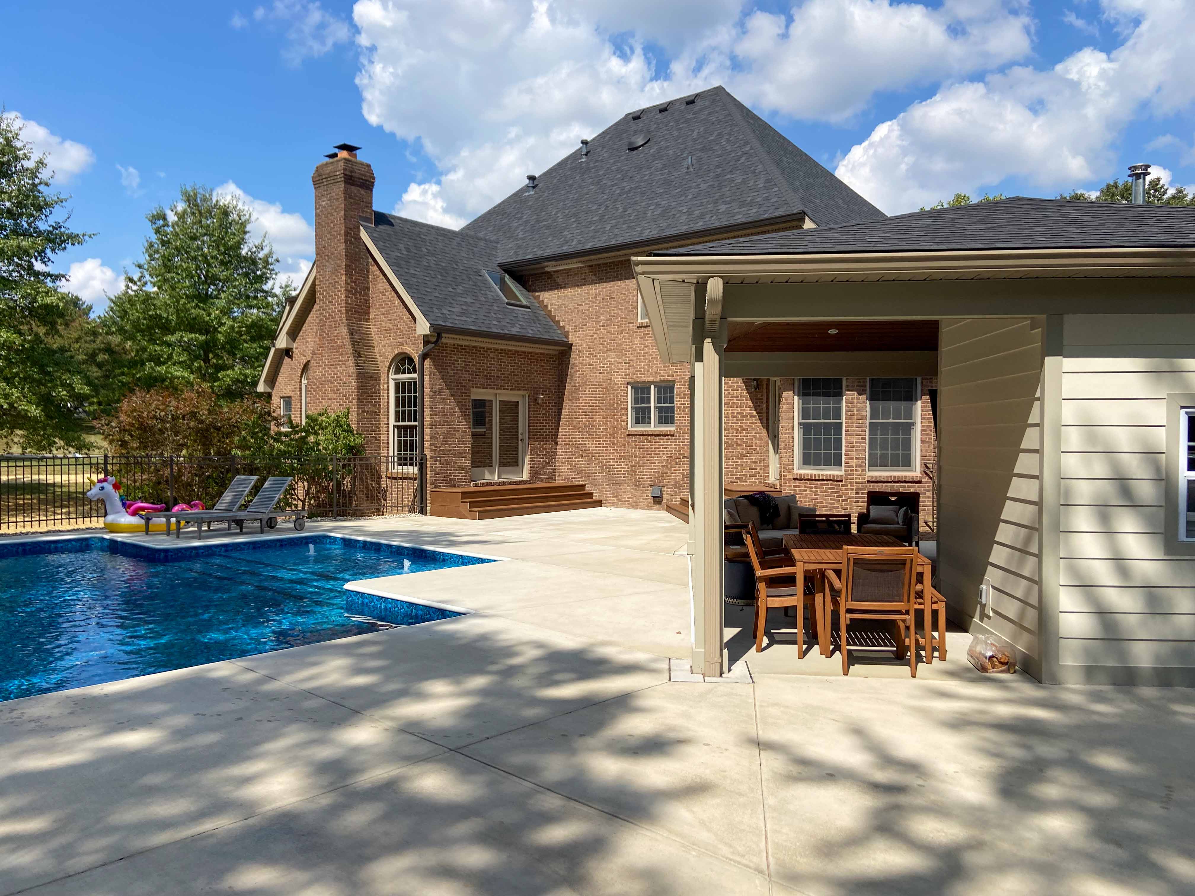 side view of pool house and composite steps