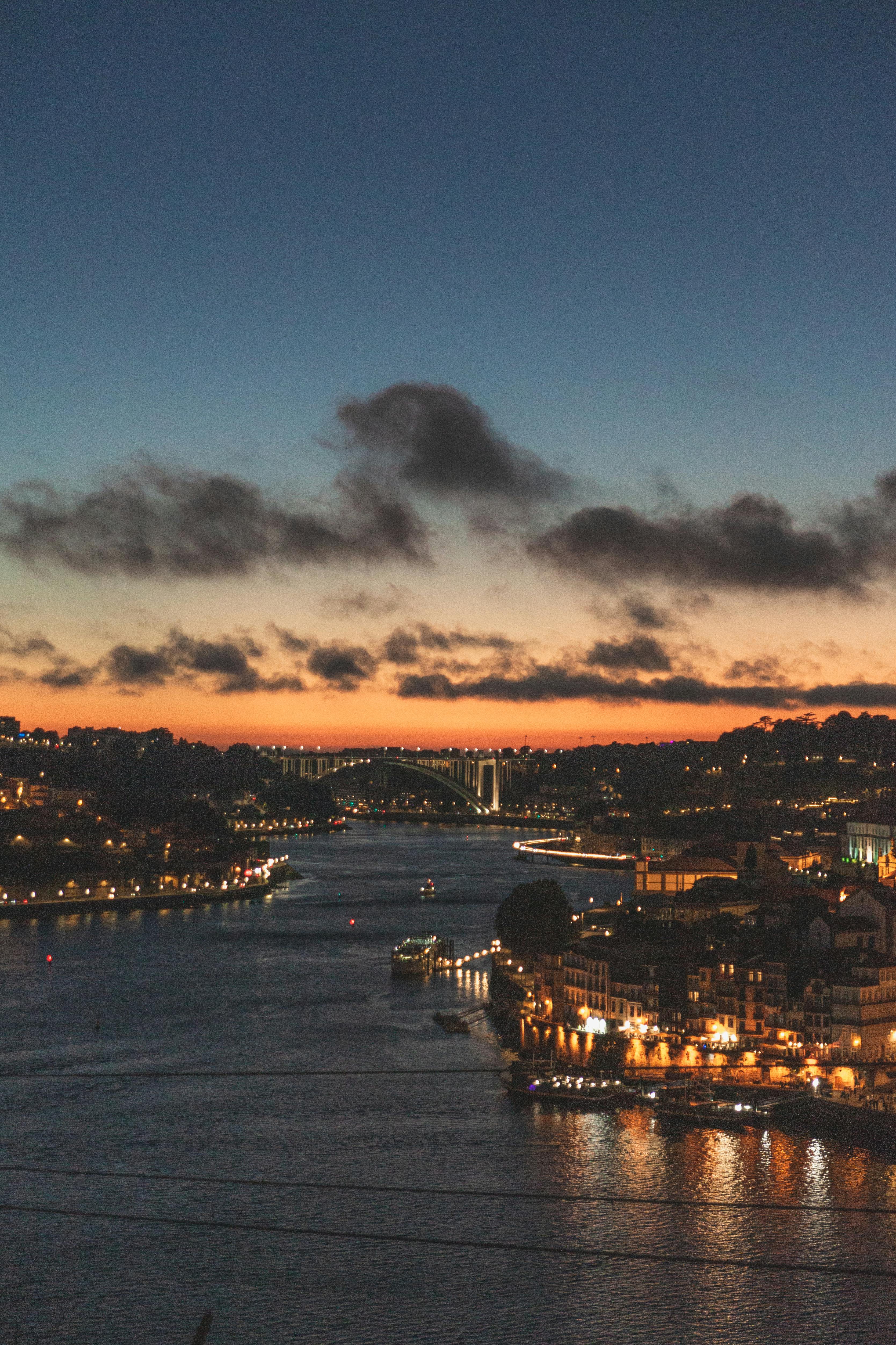 a train on the tracks next to a body of water