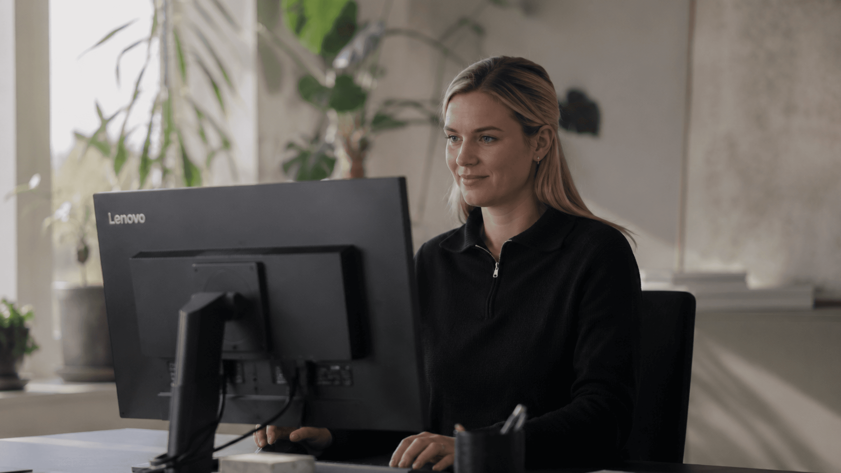 Woman sitting in front of computer