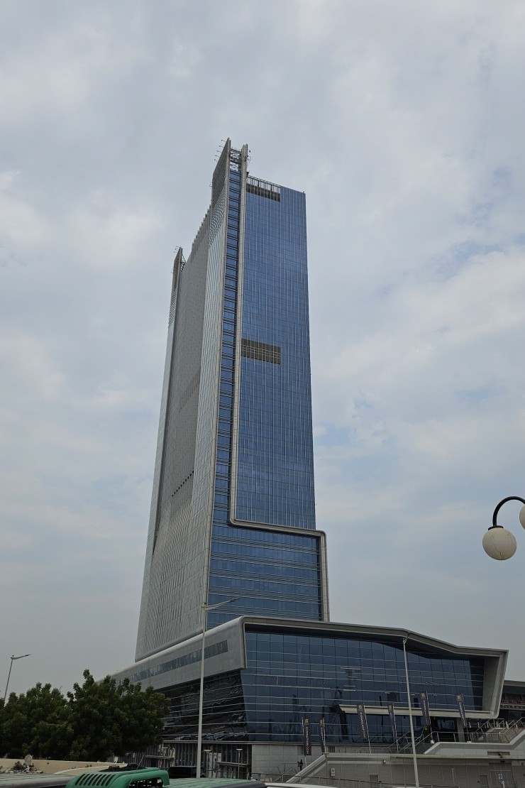 Low angle view of Control Tower under a bright sky. Your trusted real estate partner for premium workspace solutions.