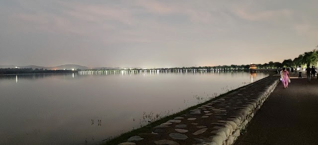 Sukhna lake and its promenade in the evening. Shivalik mountains in the background.