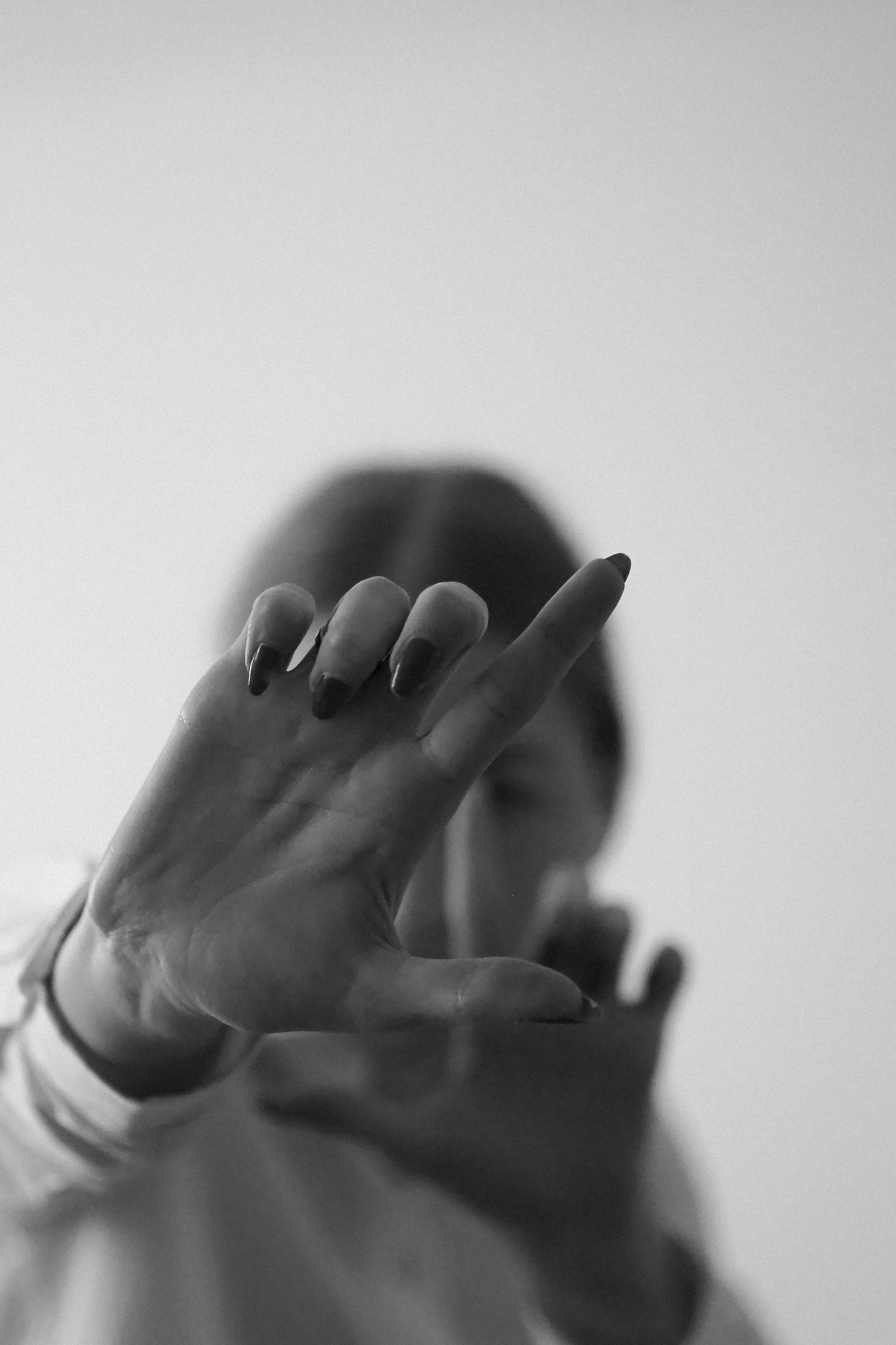 A dnamic pause of fingers crossed towards camera