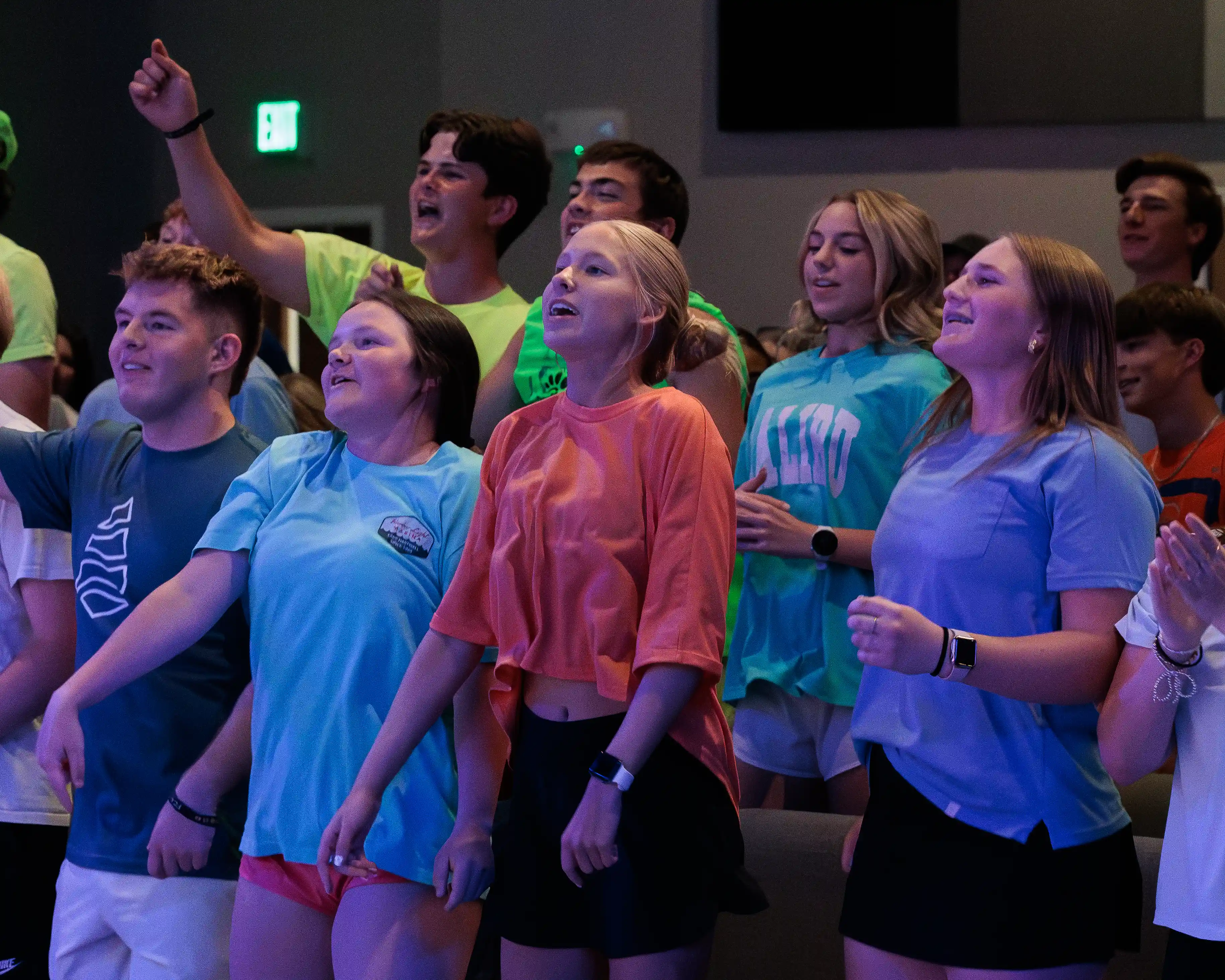 Large group of students jumping during high energy worship