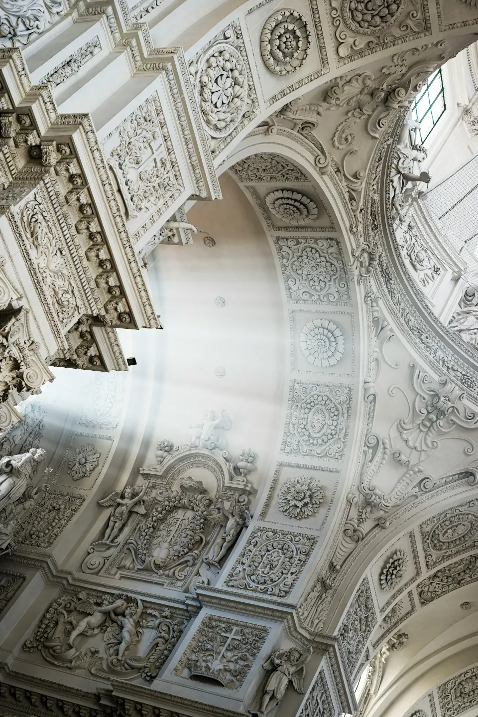 Ornate plaster ceiling and arches viewed from below