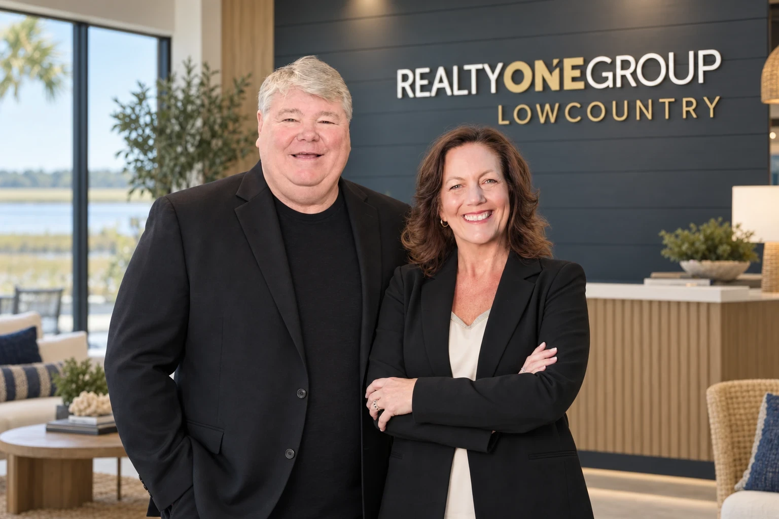 Glenn Davis and Emily Tholen in the Realty ONE Group Lowcountry office