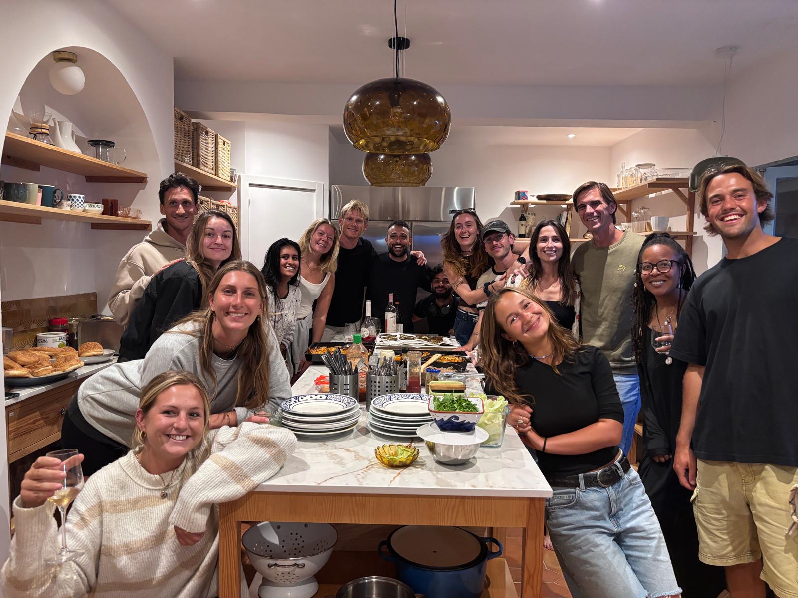 Coliving residents enjoying a communal dinner in Ericeira, Portugal