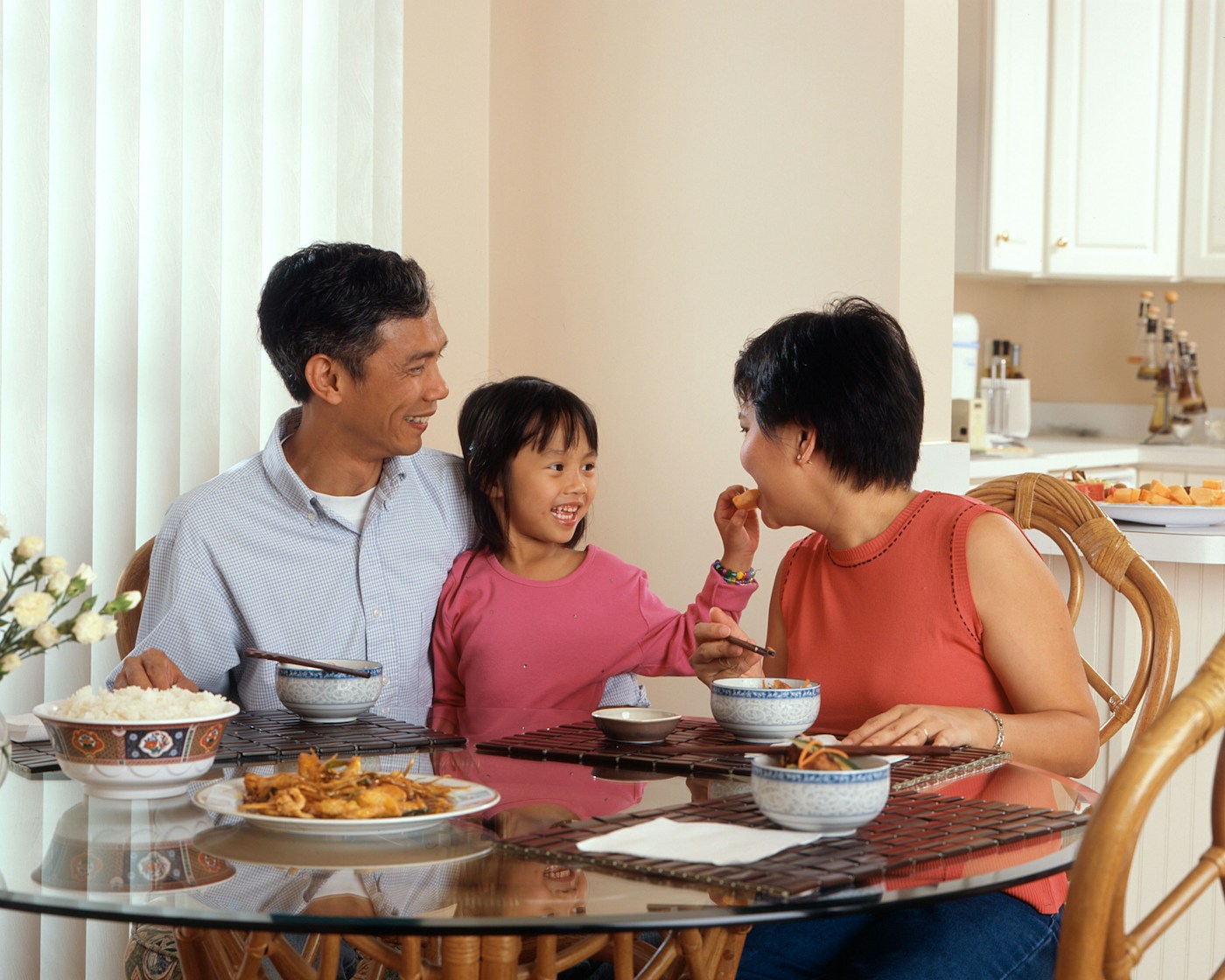 A family sharing a relaxed meal together at the table, enjoying food without pressure