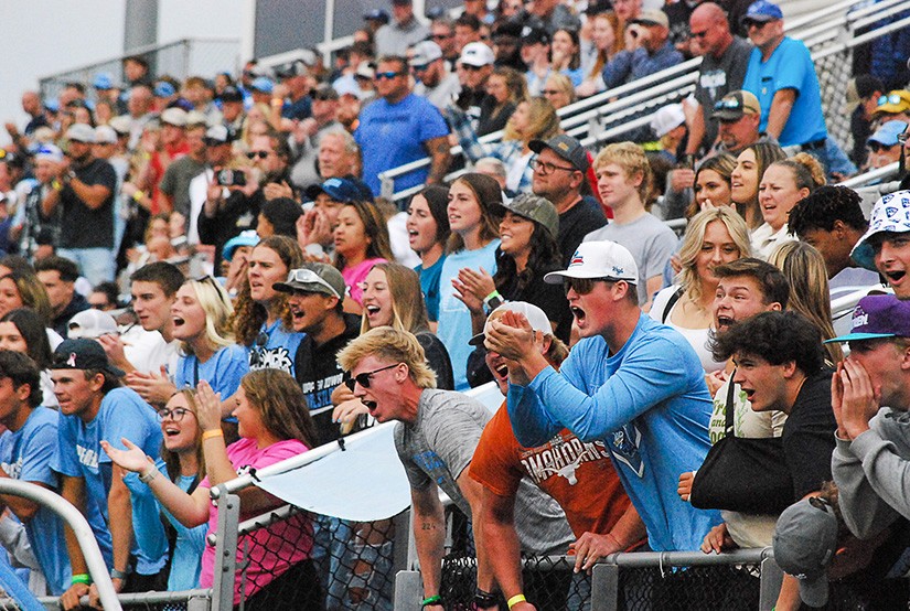 A stadium filled with cheering Upper Iowa fans dressed in light blue