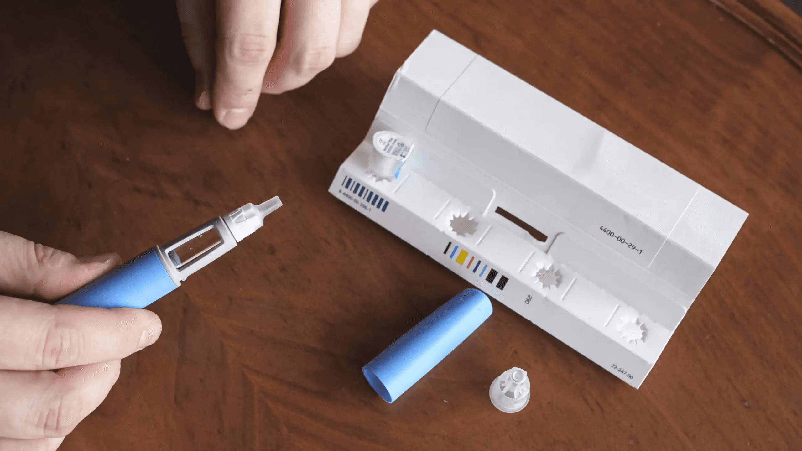 Person preparing injector device - How Does Semaglutide Work