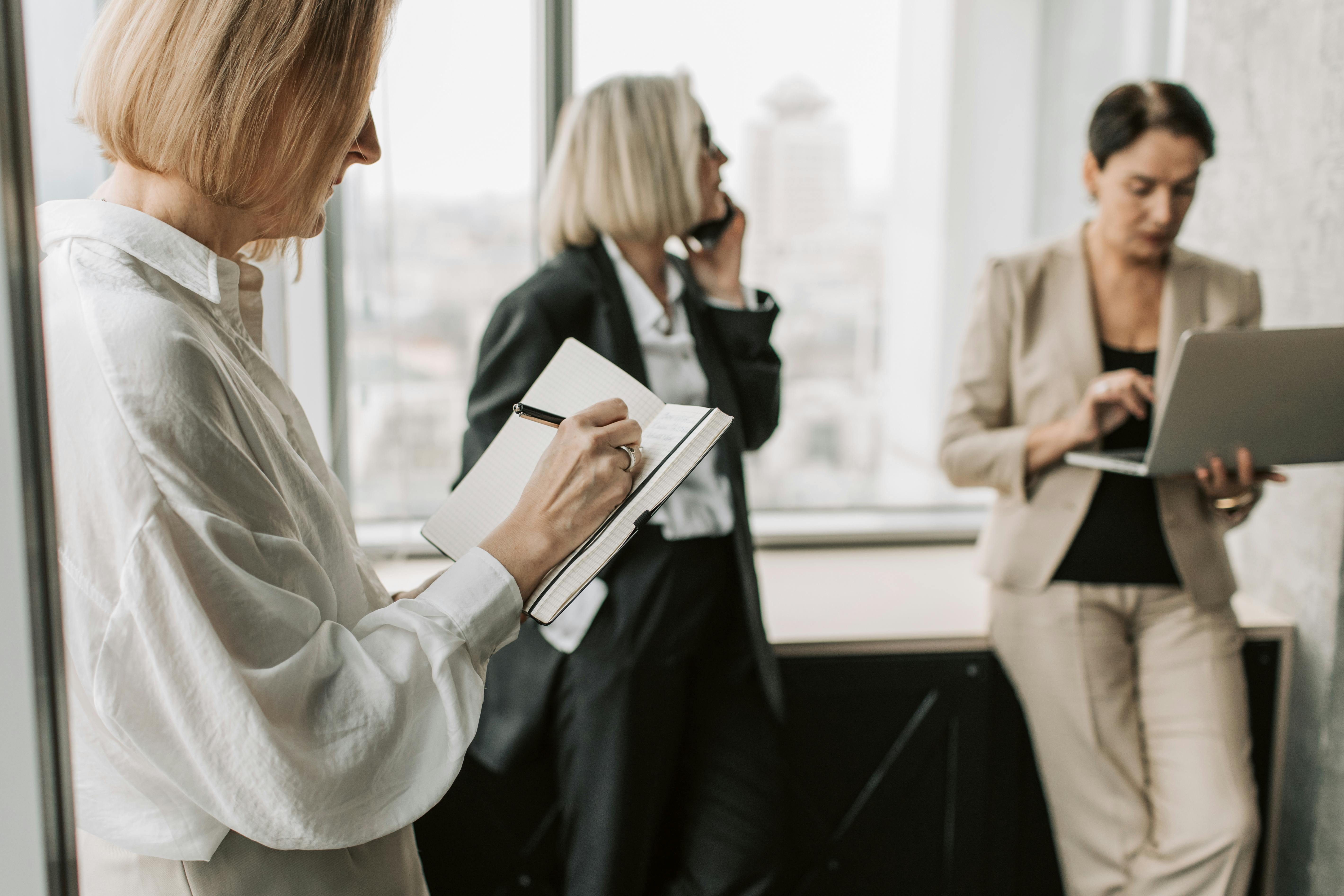 Women discussing top benefits of cold outreach for lead generation success