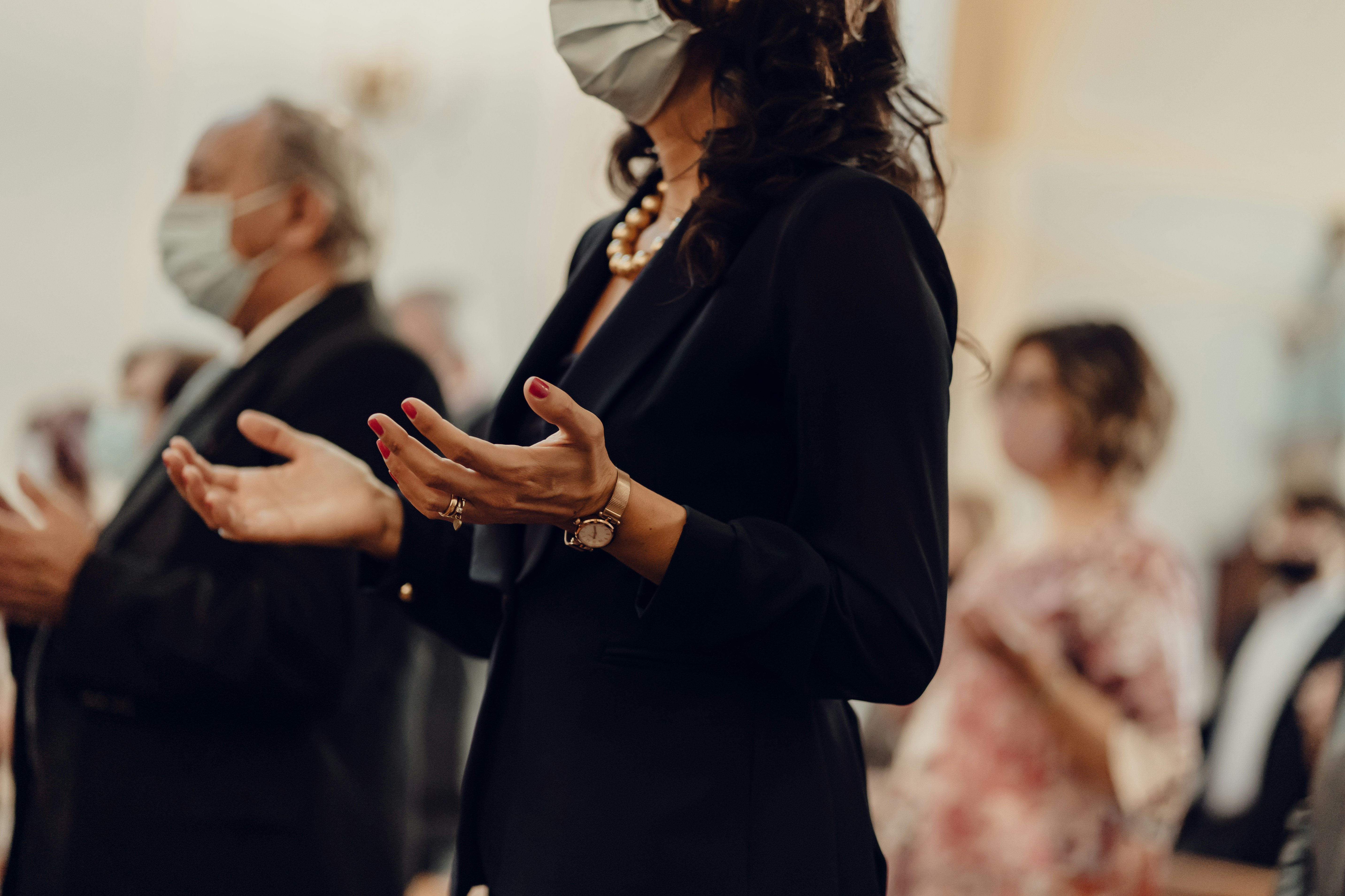 person praying at church - Fall Church Outfits