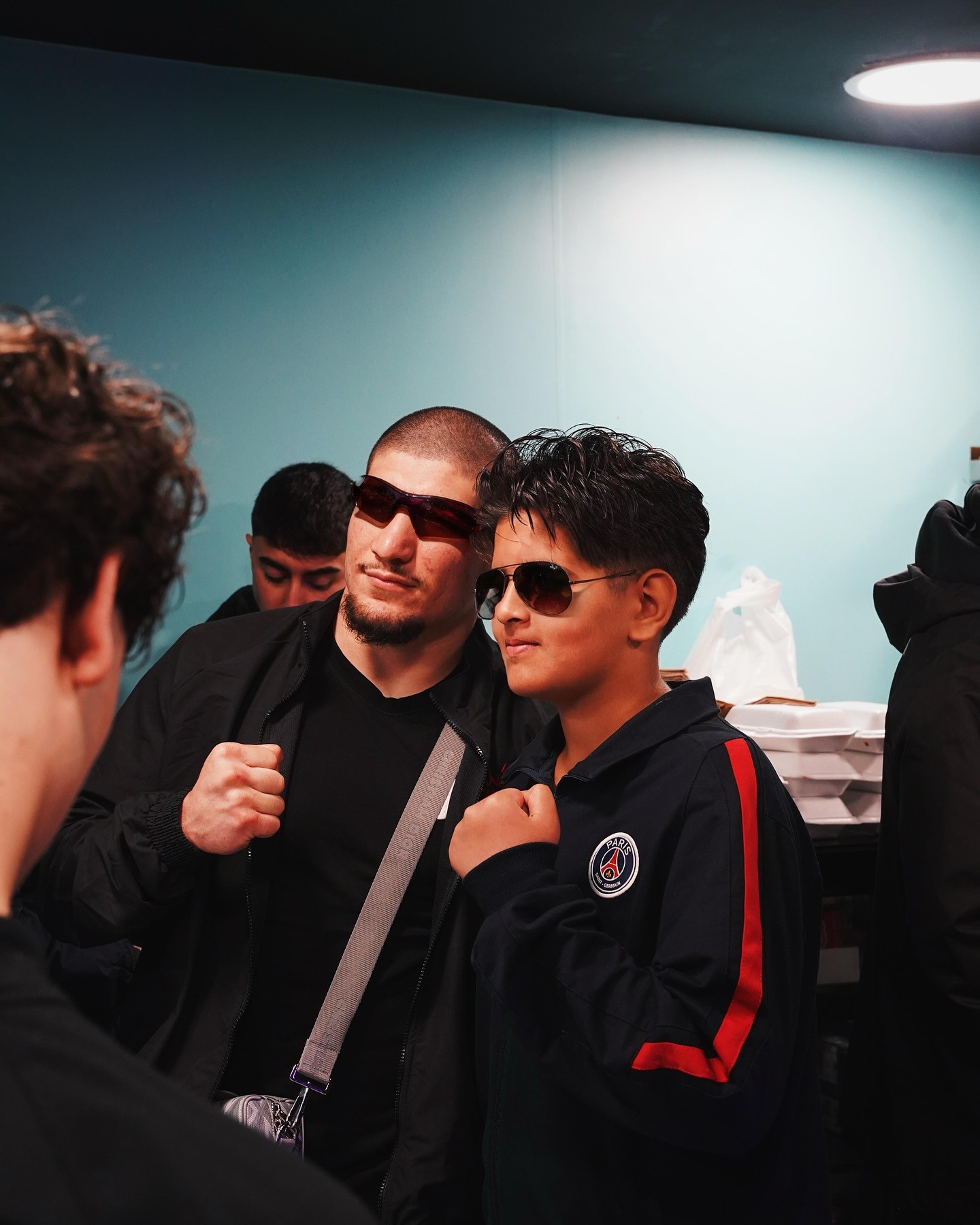 Young black woman witting at the table working on a laptop