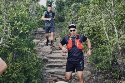 Trail runners going down the stairs on Robberg