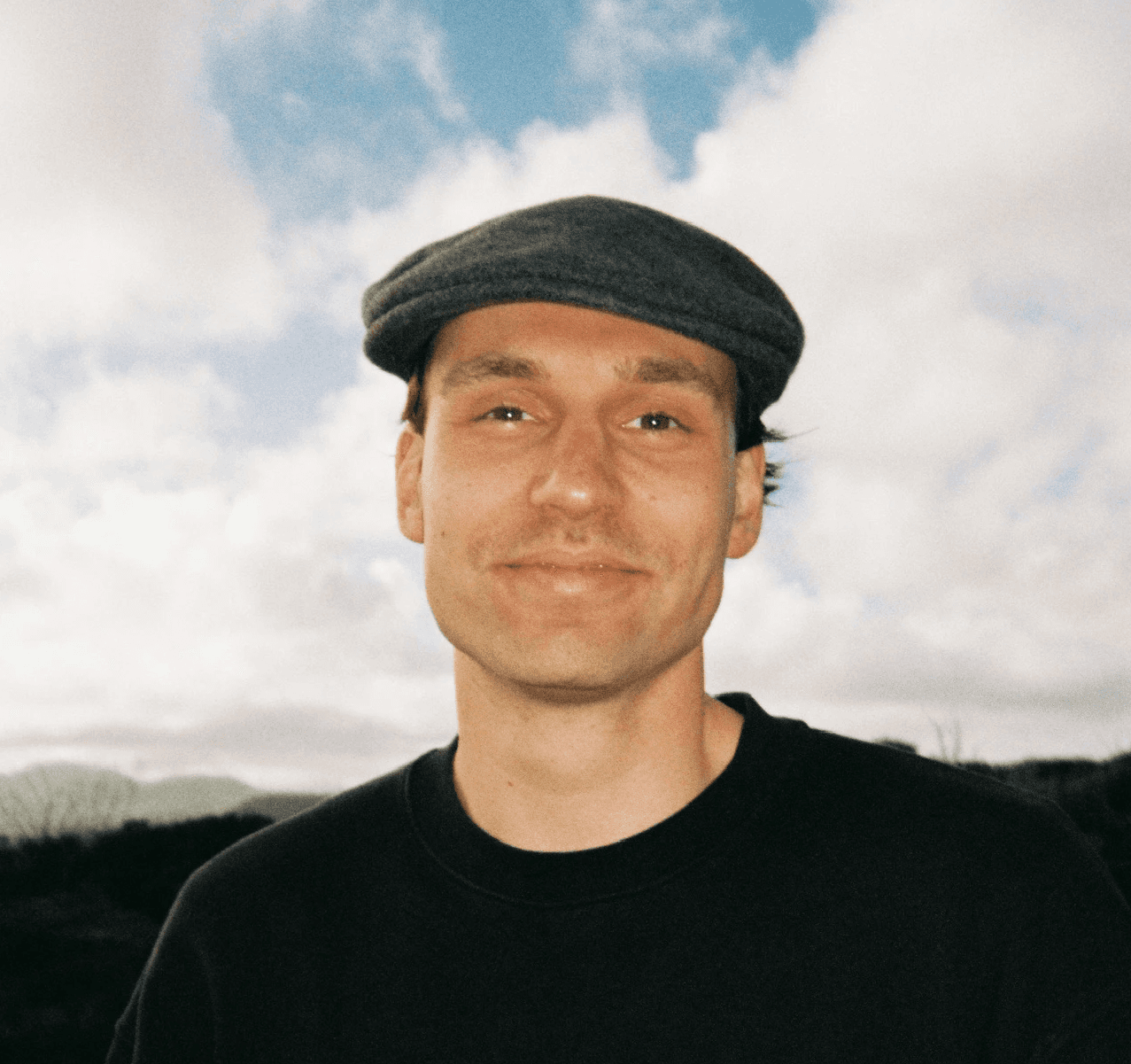 man wearing black crew-neck shirt