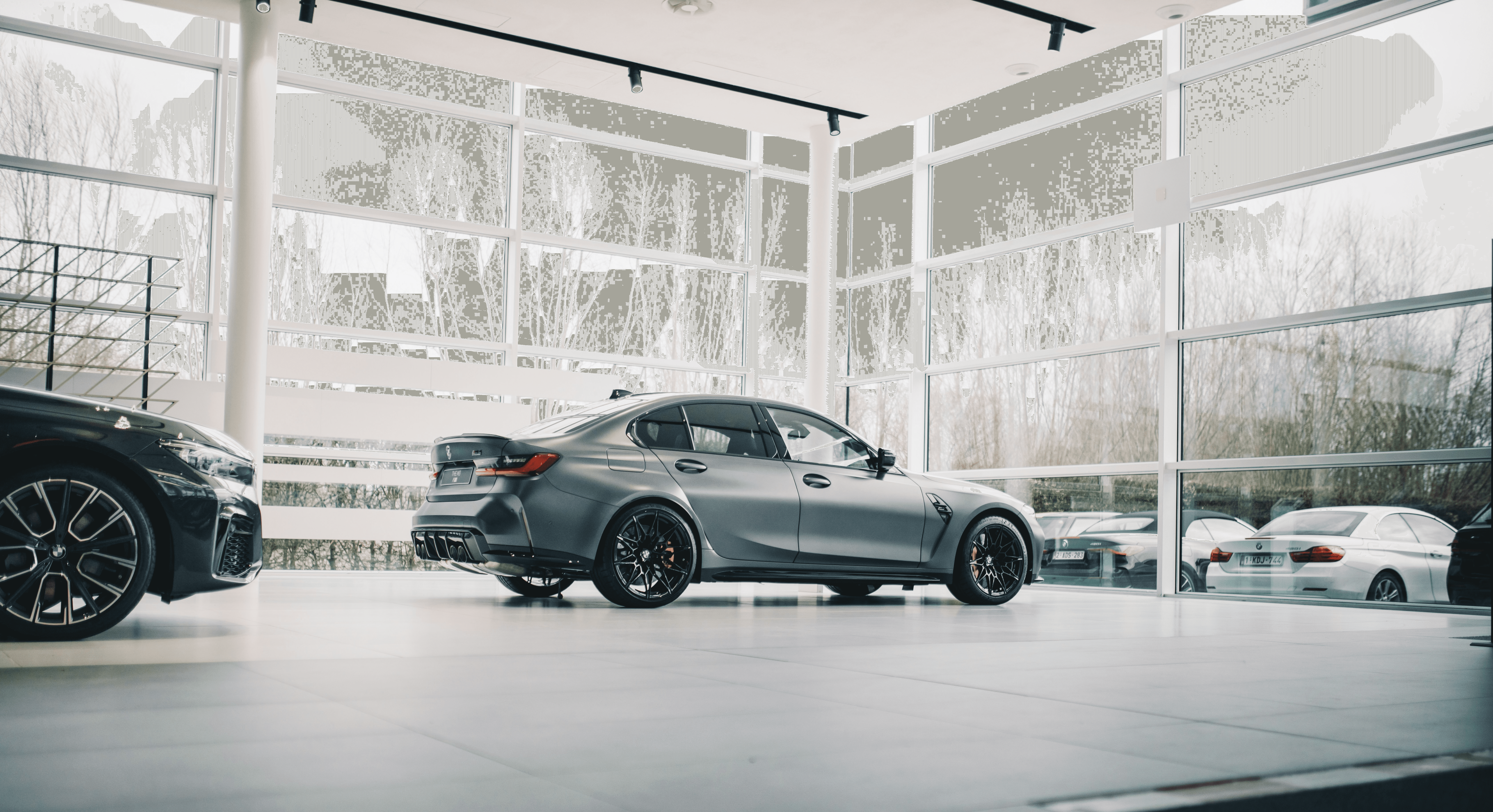 black coupe parked in a building