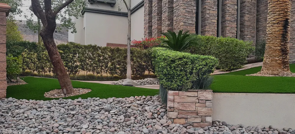 FreshStart Landscaping Vegas desert residential landscape with artificial turf rock ground cover and plants