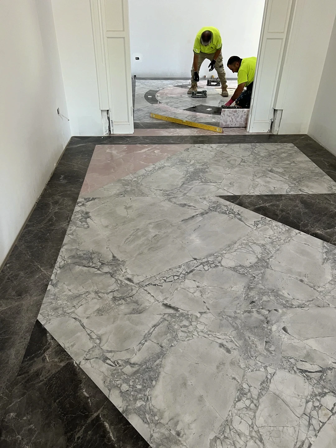 Bookmatched marble floor slab prepared for a custom stone floor layout, with natural veining selected to support a seamless decorative floor design.