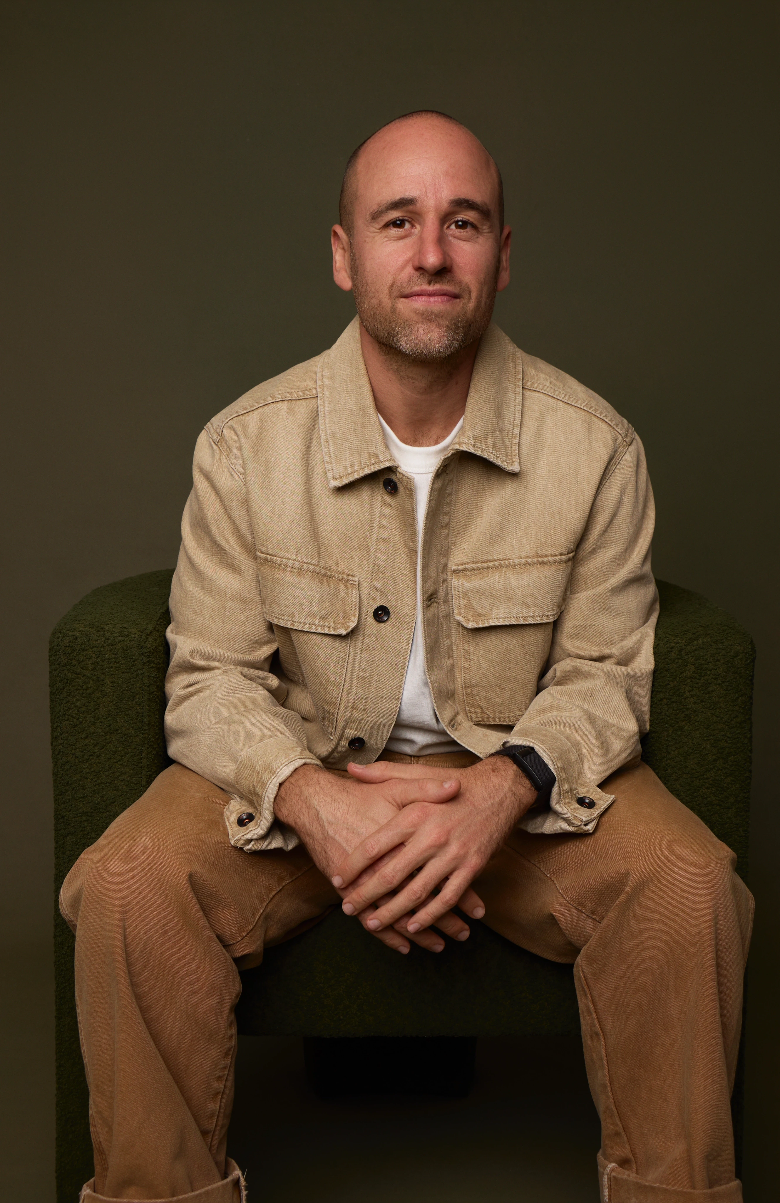 Eric Posner, RIPE Co-Founder and CEO, portrait in denim jacket