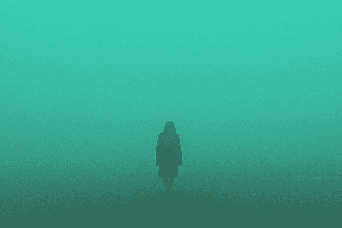 A mysterious silhouette in a foggy, green-hued landscape, creating an ethereal and enigmatic atmosphere.