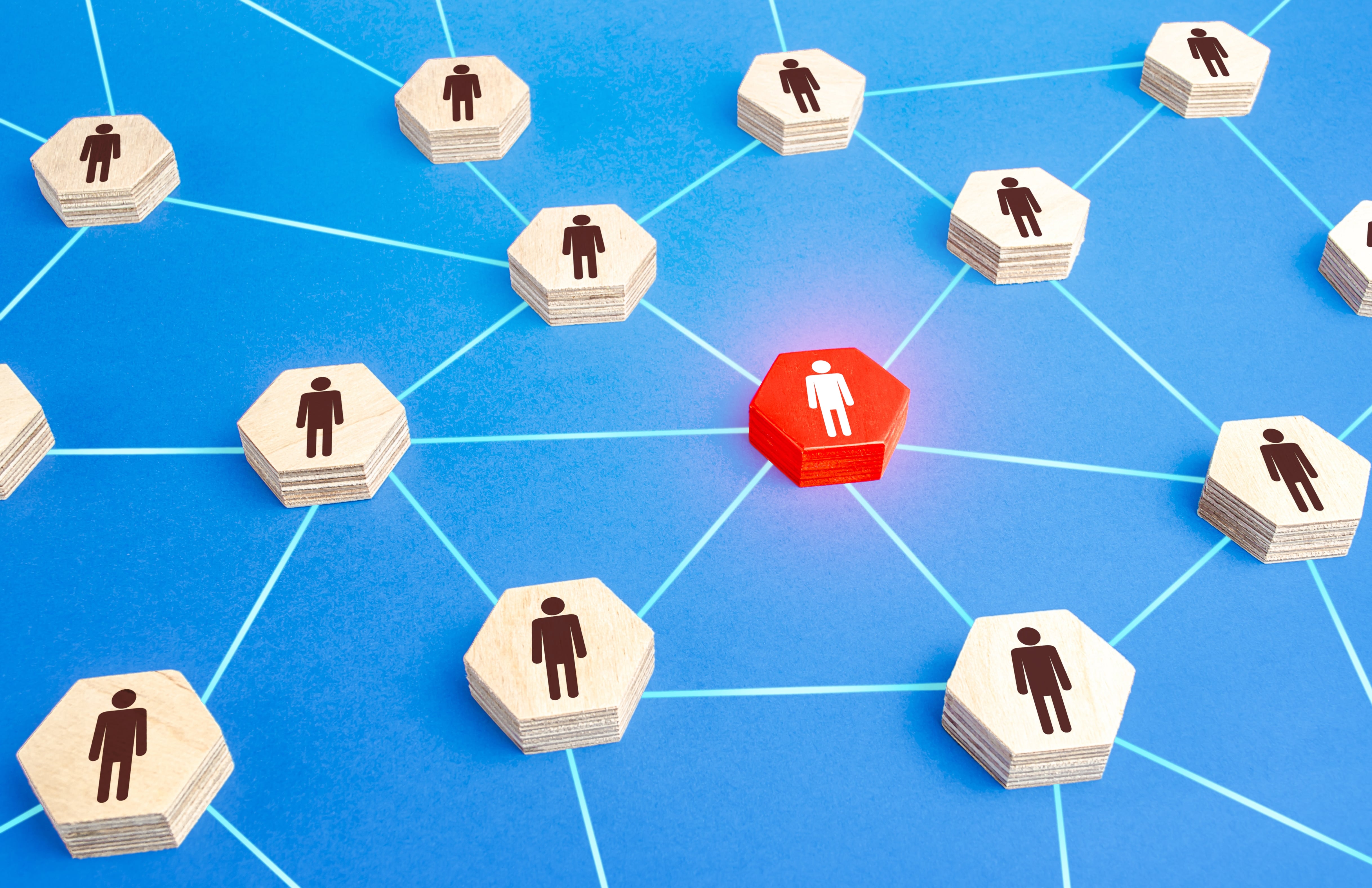 Network of connected individuals with a red hexagon symbolizing a toxic or disruptive person in the system