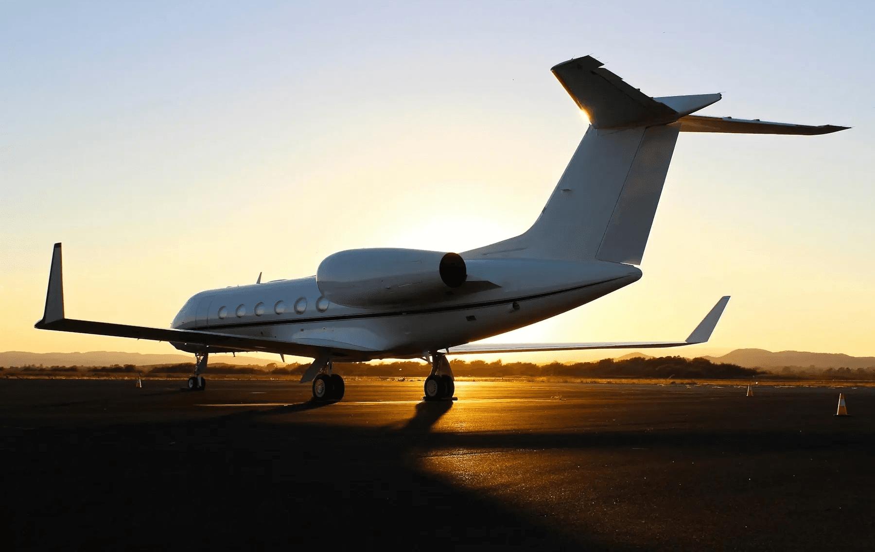 Private jet on a tarmac at golden hour