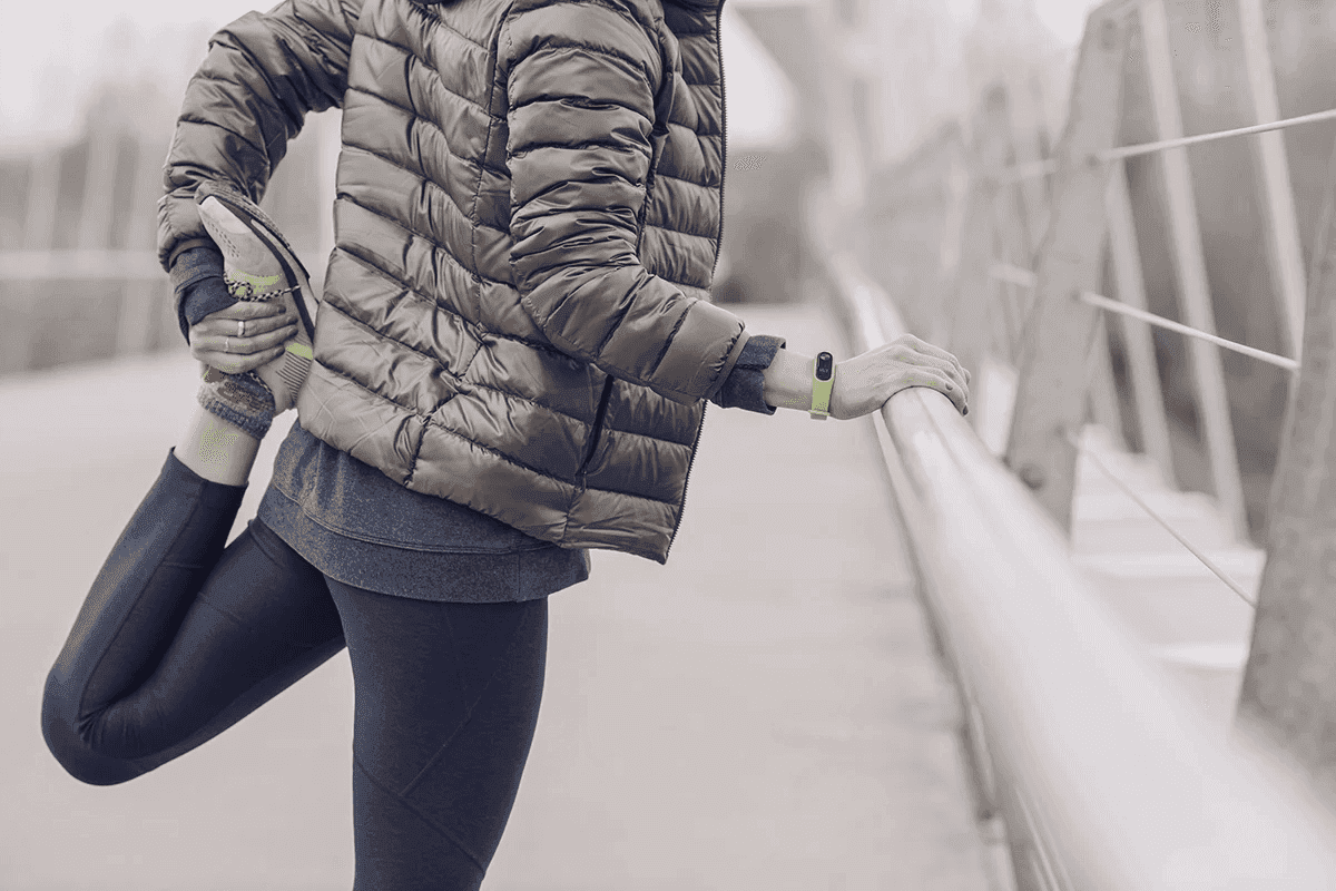 Person stretching outdoors to support muscle strength and healthy movement