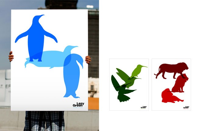 A person holds a large white poster displaying a blue penguin and a light blue penguin overlapping, with a light blue penguin overlapping a light blue penguin. The poster is labeled “Lazy Green” in the bottom left corner. Beside the poster are two smaller prints: one showing a green hummingbird in flight, and the other showing a red lion and a red lioness.