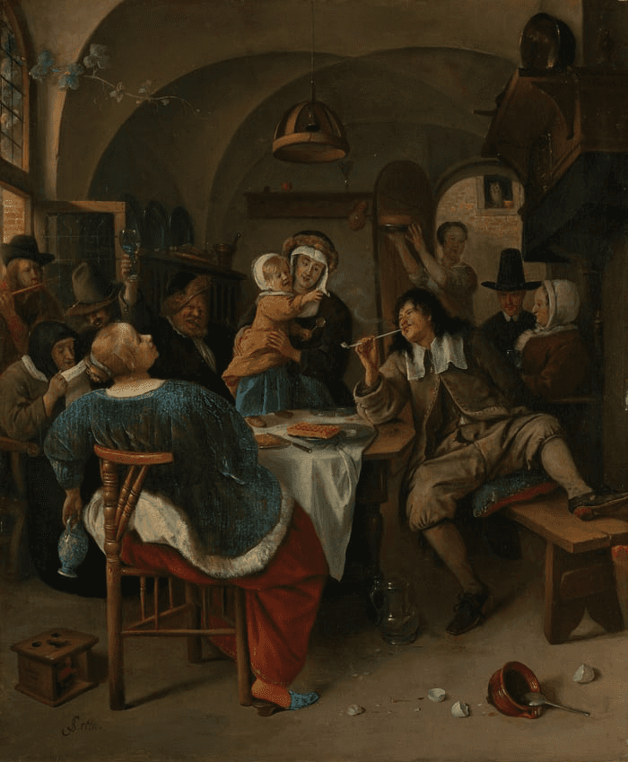 A bustling tavern scene with patrons seated at a table, enjoying food and drink while others mingle around.