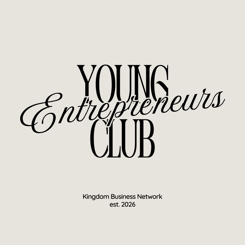 man in pink dress shirt wearing black sunglasses sitting on gray couch