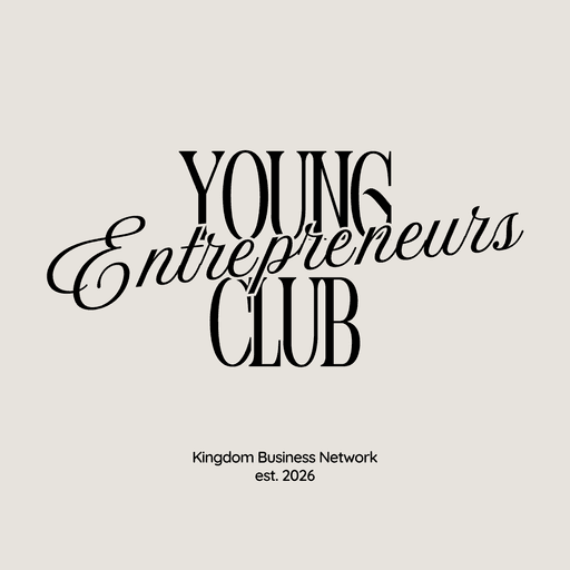 man in black shirt standing beside counter