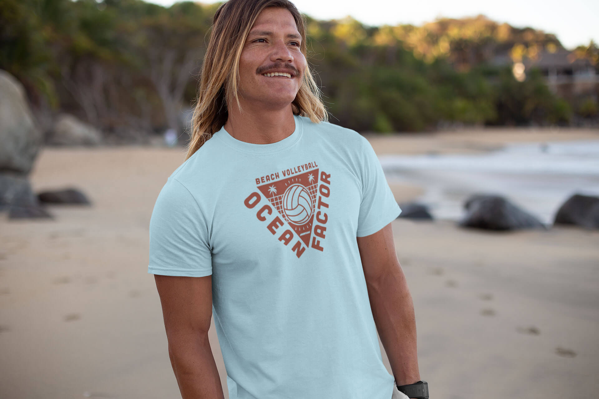 Male model standing on the beach modeling beach volleyball tshirt