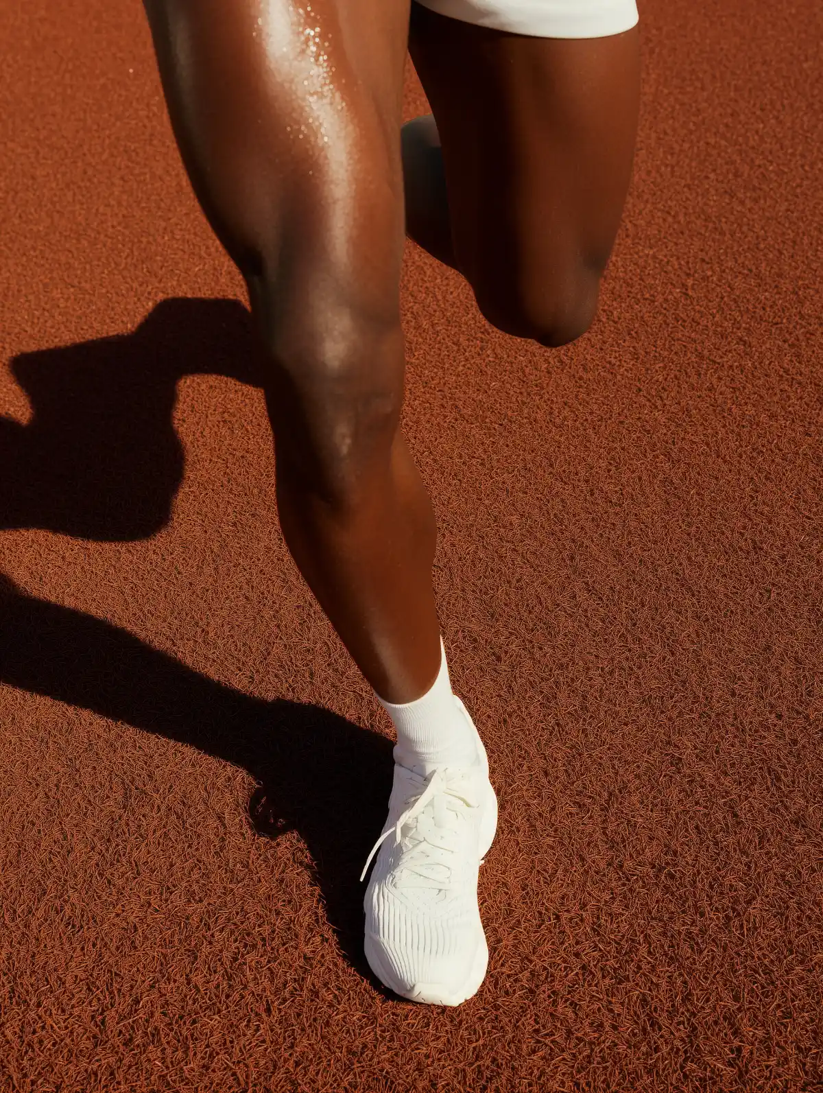 Four smooth eggs in muted tones of pink, green, peach, and black, showcased against a cream background for a minimalist aesthetic.