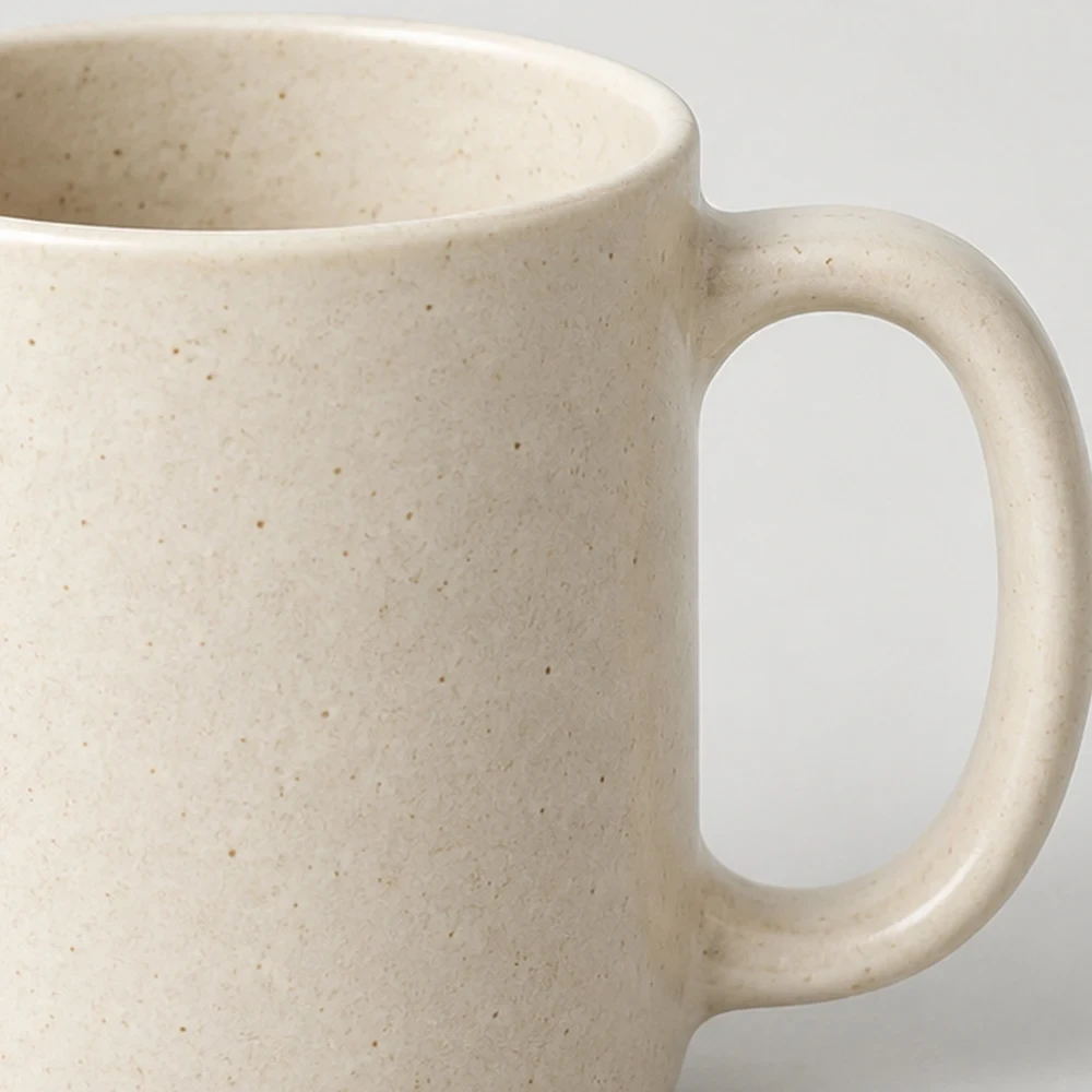 Close-up of a speckled stoneware mug