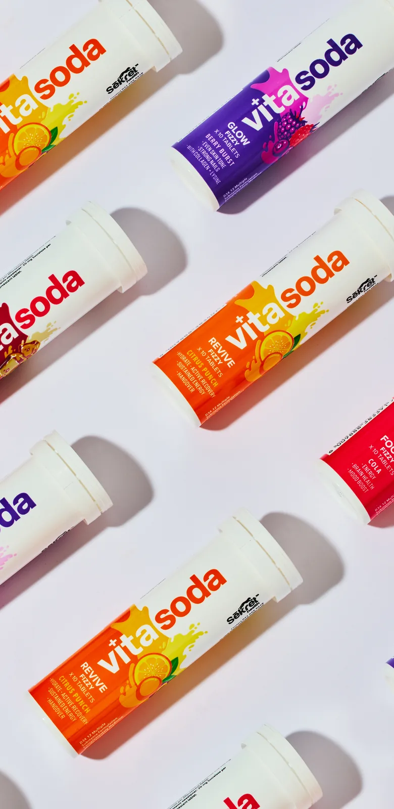 Vita Soda Focus, Glow and Revive tubes laid in a diagonal pattern on white