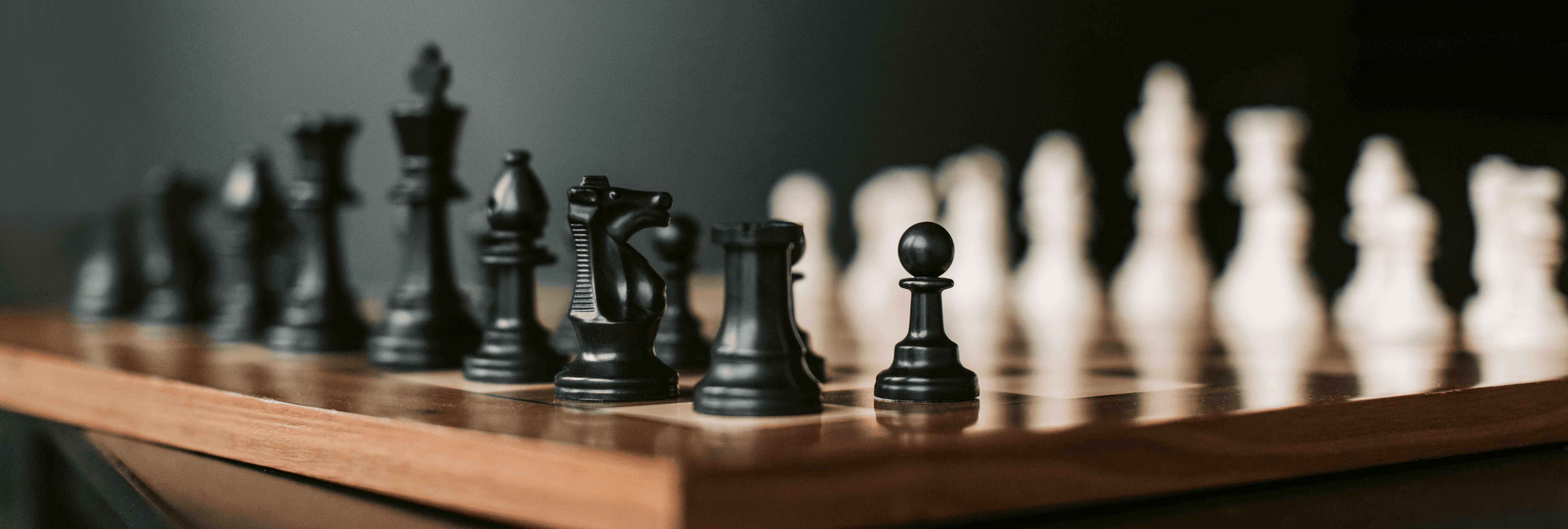 a close up of a chess board with pieces on it
