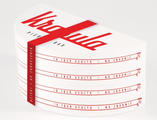 The image shows a stack of white rectangular cards, each with the text "TO YOUR HEALTH | NA ZDROWIE" written in a red, sans-serif font. A red ribbon is tied around the stack, partially obscuring the text "NA ZDROWIE". The top card prominently displays "Wardia PIER BAR" in large, bold letters. The cards are neatly stacked and appear to be part of a design for a product or service related to health or wellness.