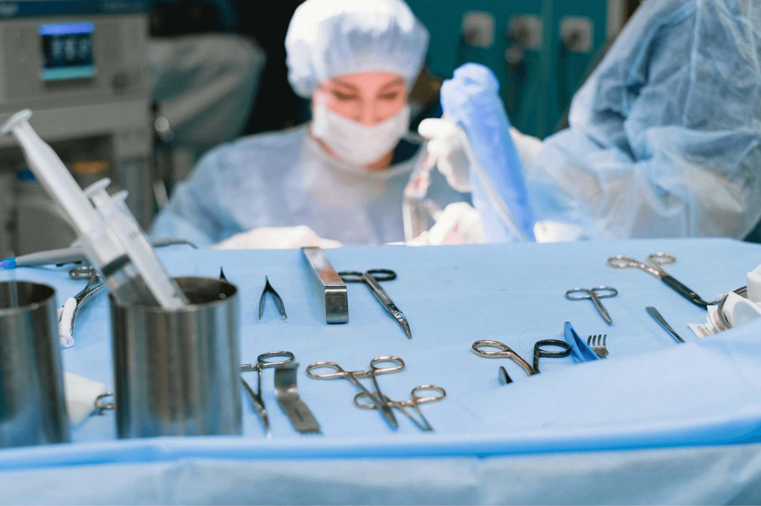 Surgical Equipment and Surgeon Performing Surgery. Courtesy of Pexels
