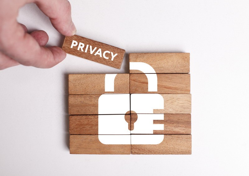 Business, Technology, Internet and network concept. Young businessman shows the word: Privacy