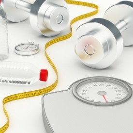 Dumbbells, measuring tapge, and a scale