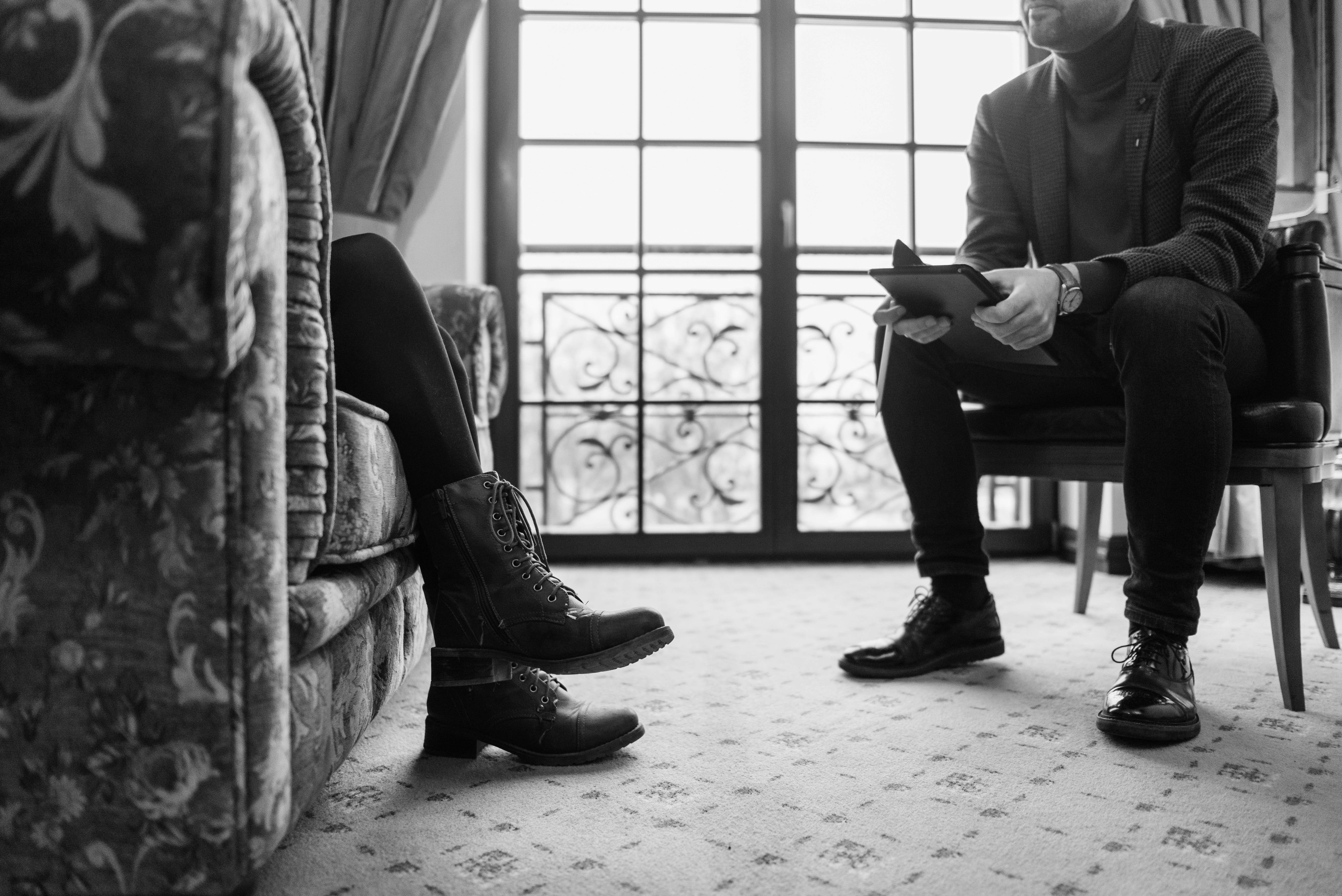 Therapist and adult client during a professional therapy session