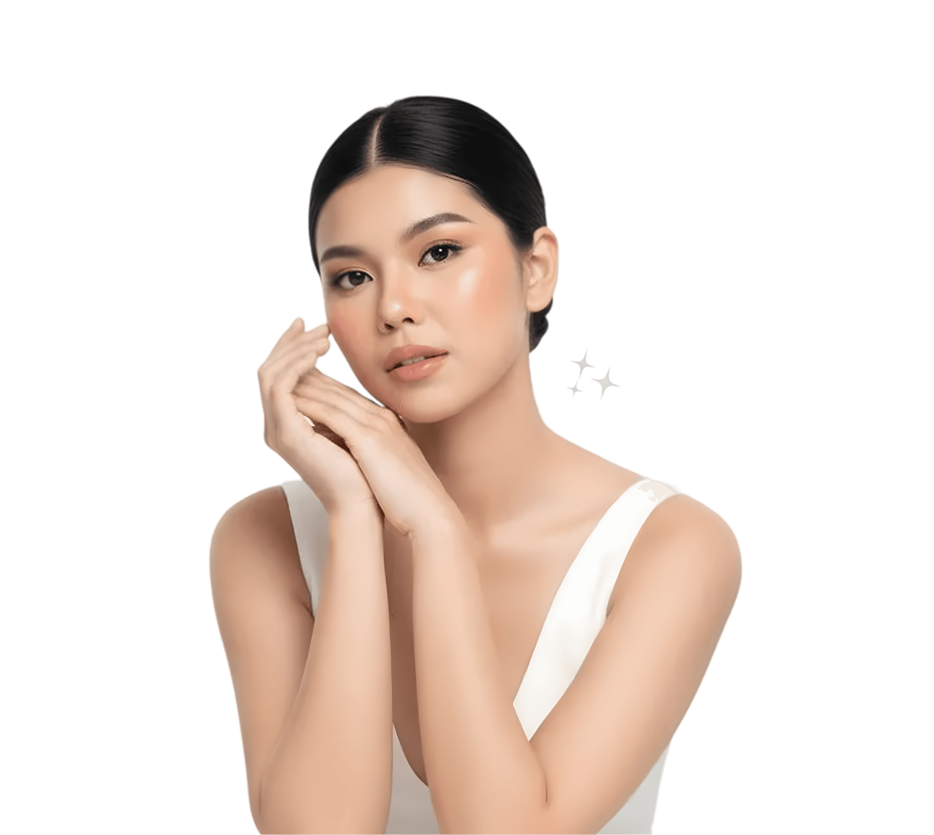 A smiling woman with her arms crossed, standing against a dark green background. She has long, dark hair.