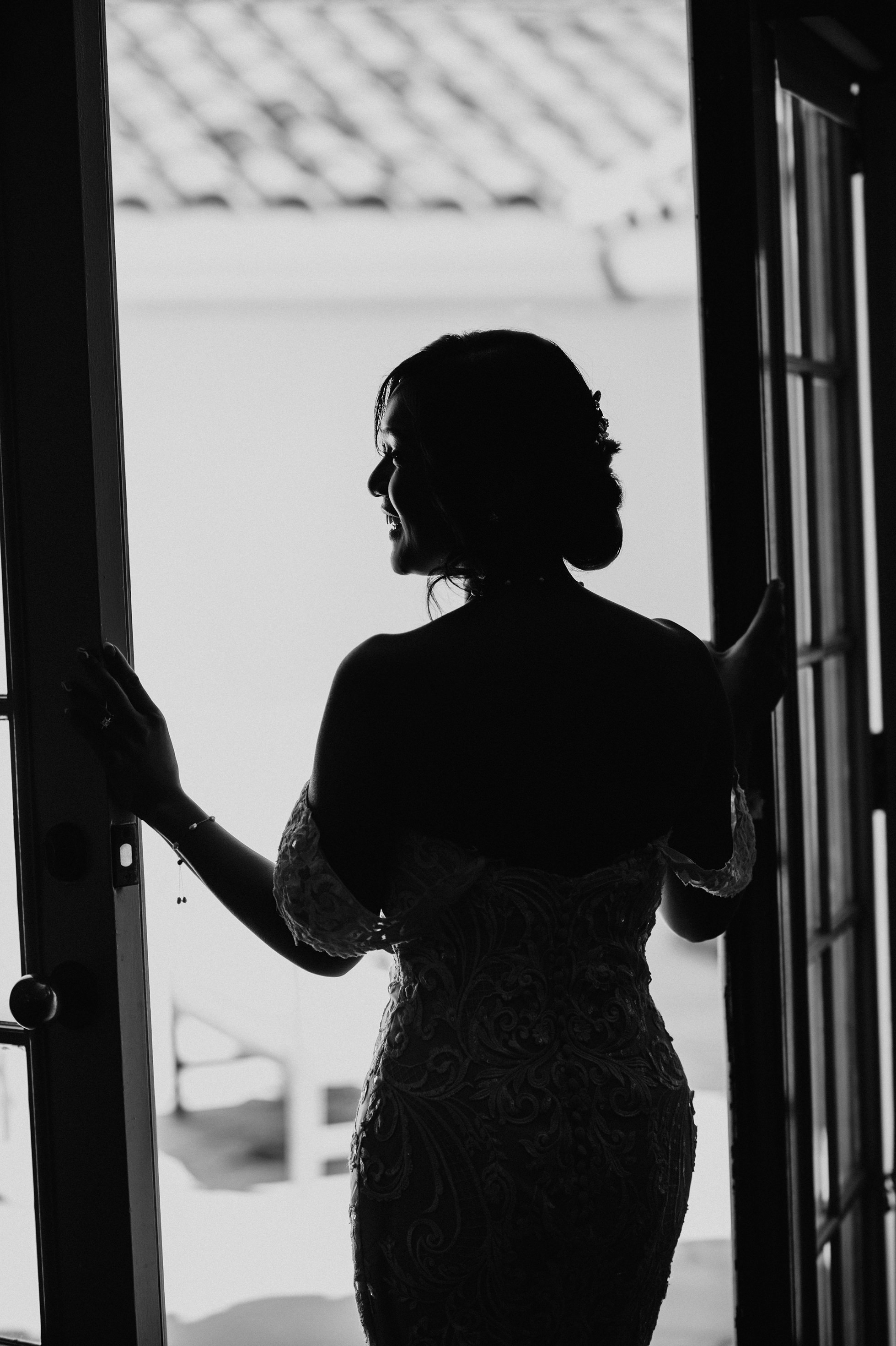 Flat lay wedding details with bouquet, rings, and sparkling bridal heels