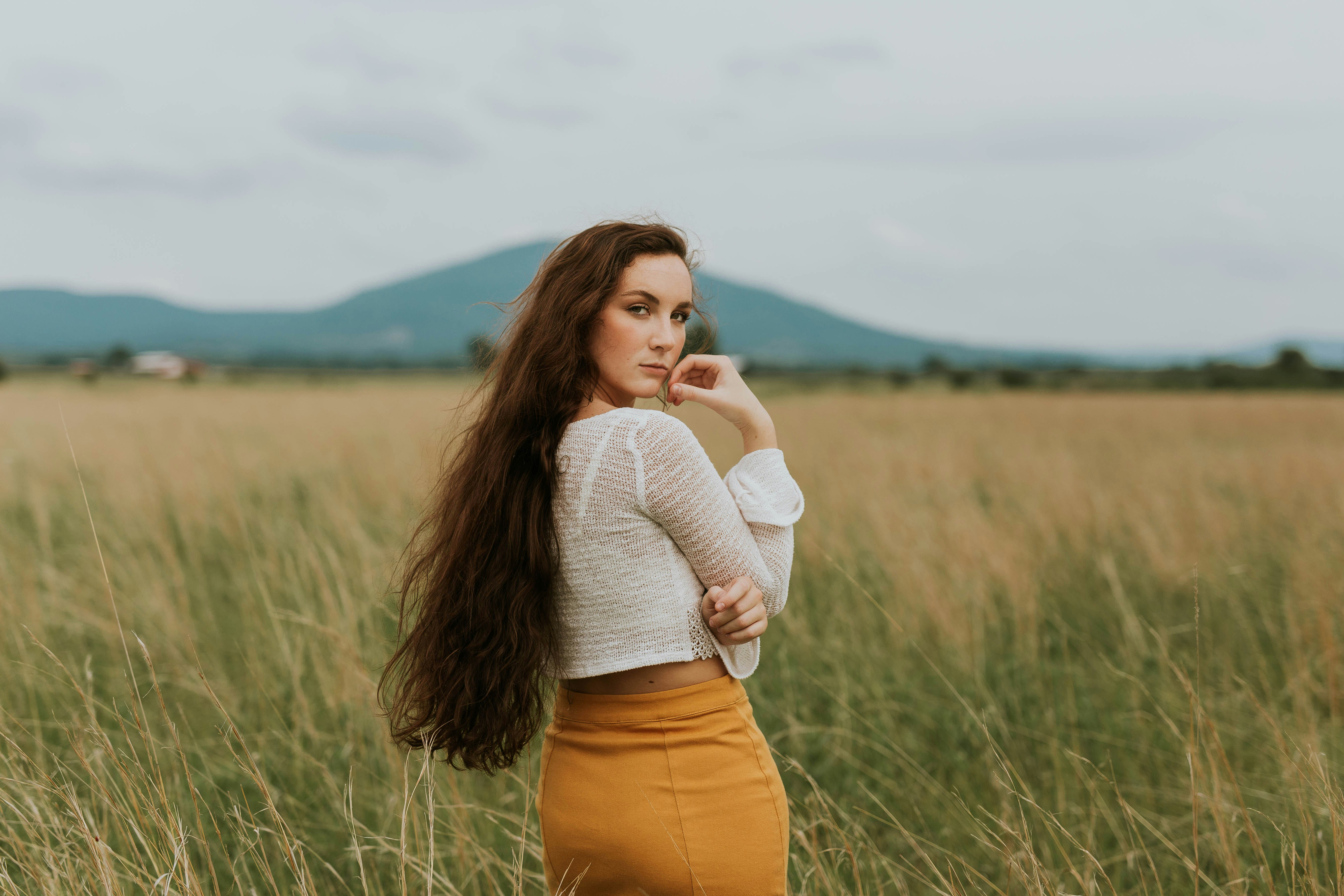 woman walking a forest - Cozy Fall Outfits