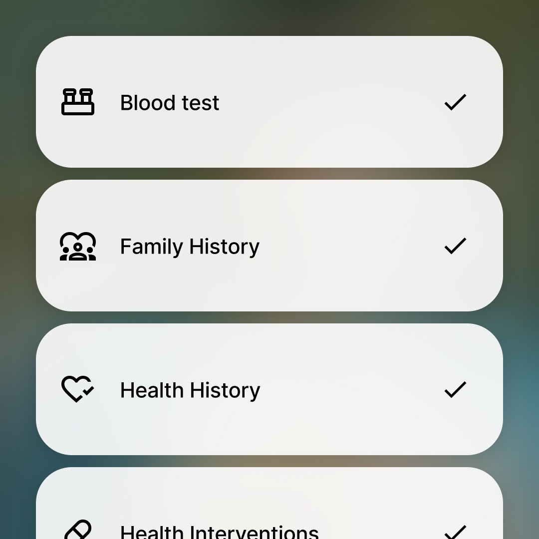 a gloved hand holding a test tube filled with liquid