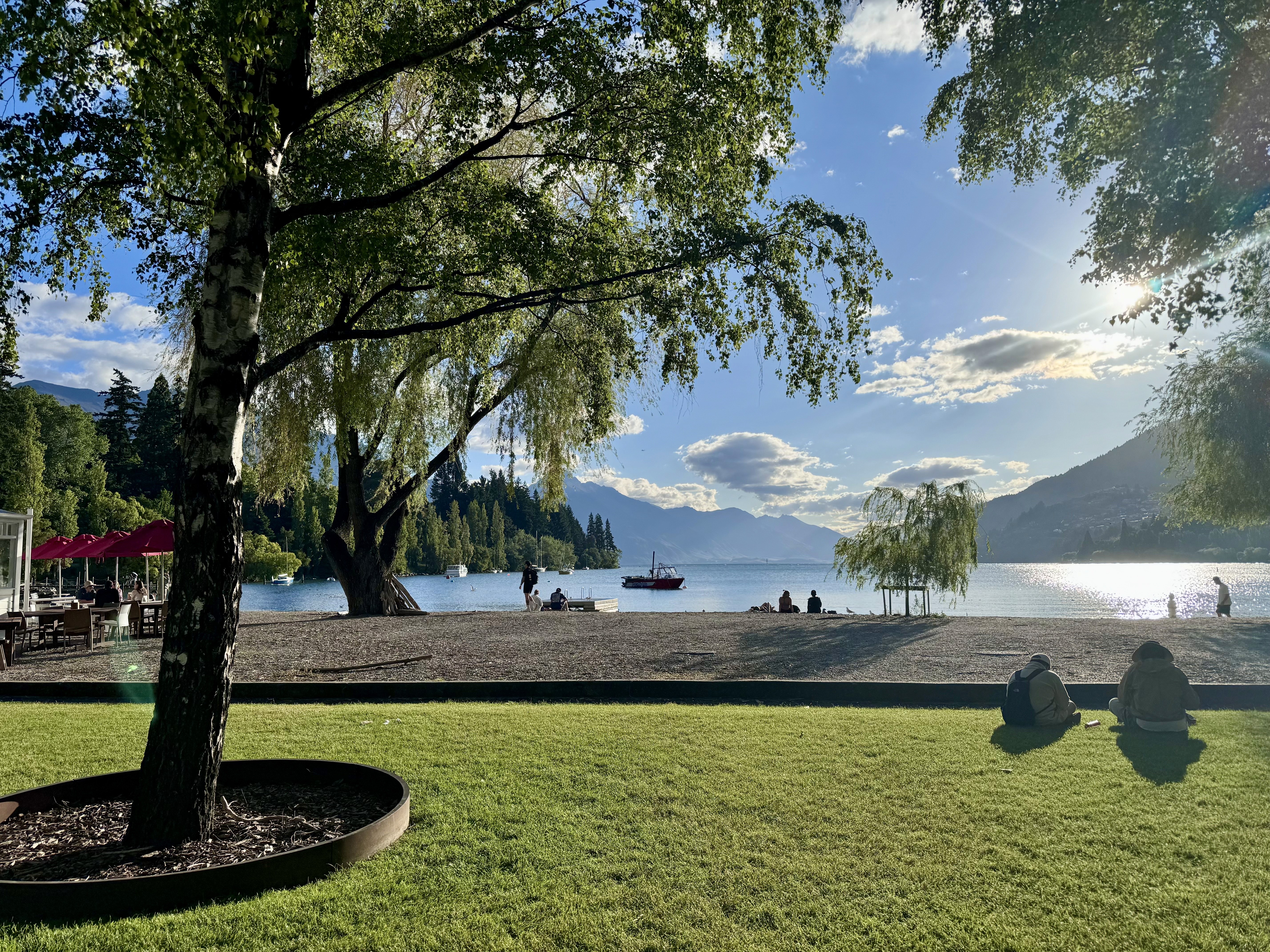 The bay beach at Lake Wakatipu with a view of the Remarkables