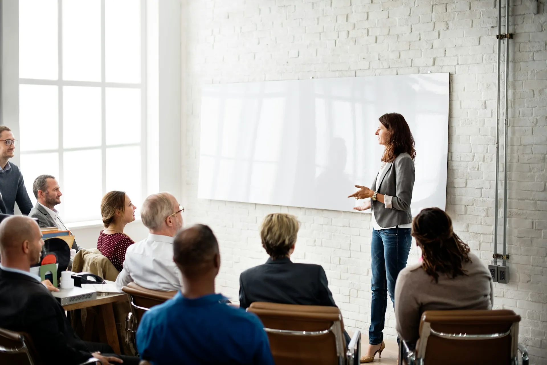 Women presenting about staff augmentation to an audience